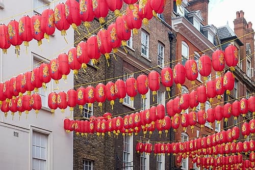 London, England, UK. Chinatown district. Red lanterns, old phone booths and souvenirs are found. European Print